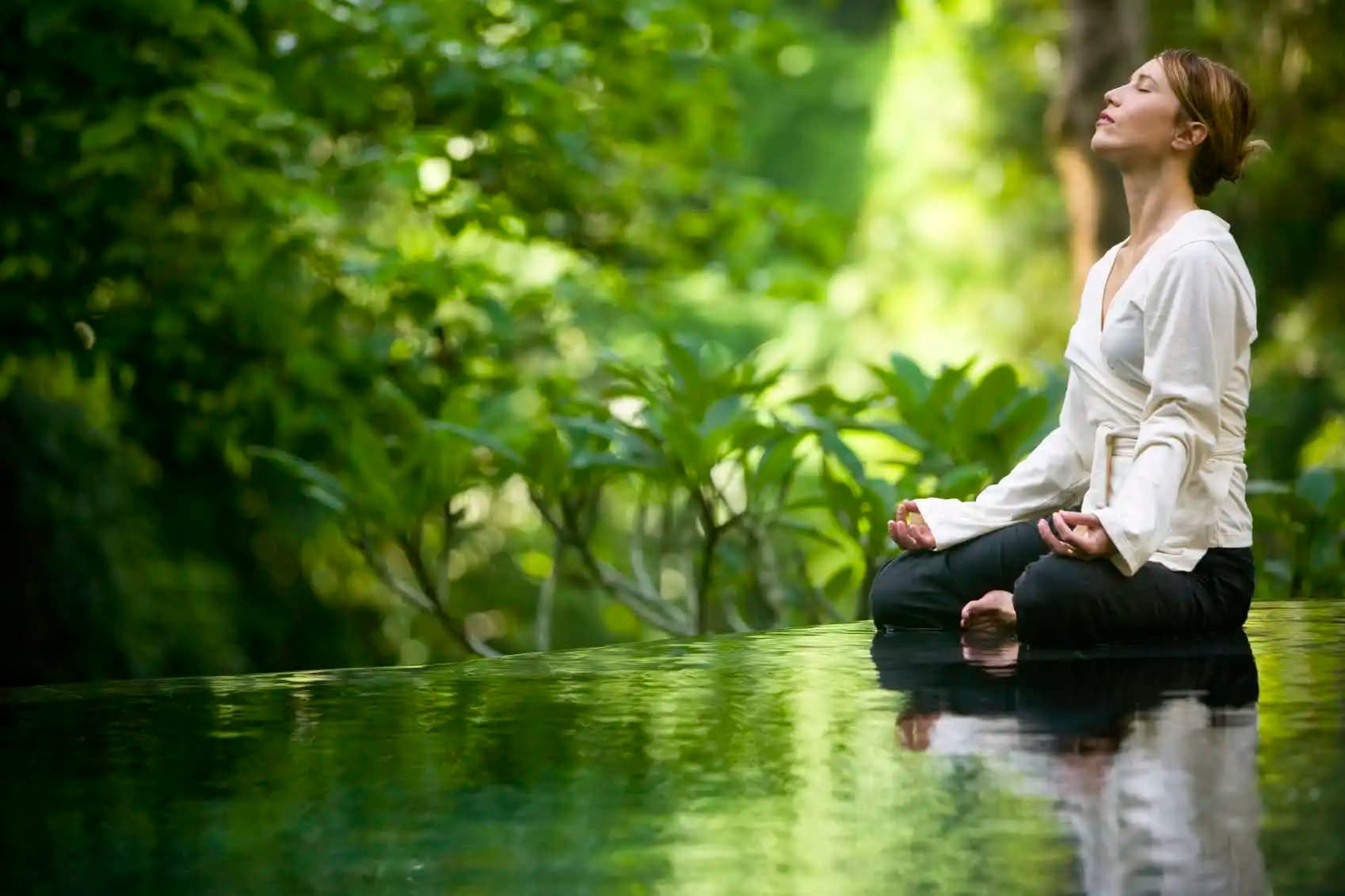 Yoga and meditation by tropical pool